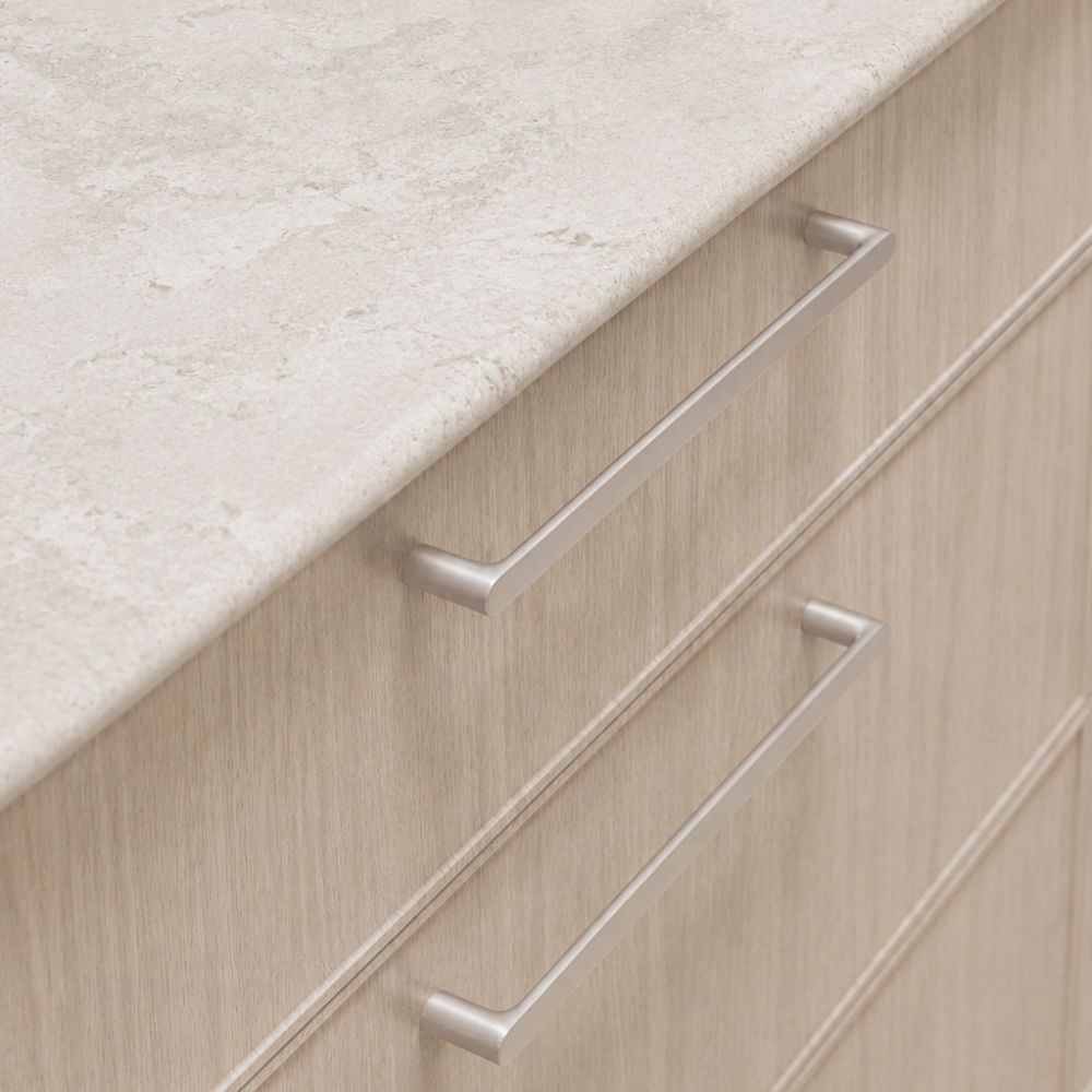 Brushed nickel cabinet pull on whitewashed oak cabinetry