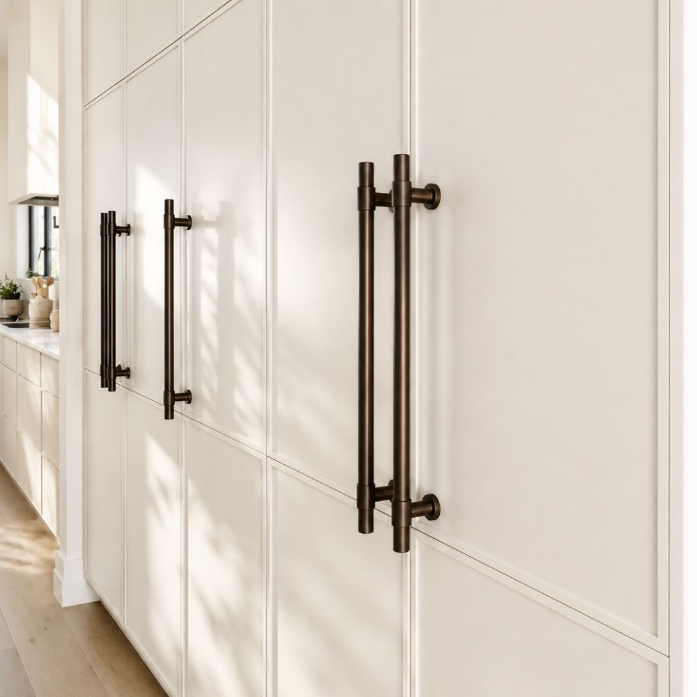Contemporary architectural joinery with burnished bronze door pulls