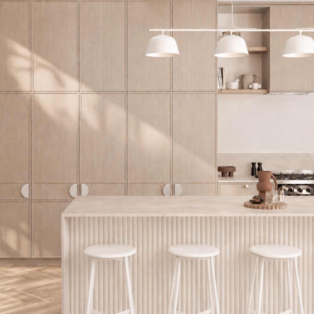 Coastal kitchen with brushed nickel cabinet hardware and pale timber joinery